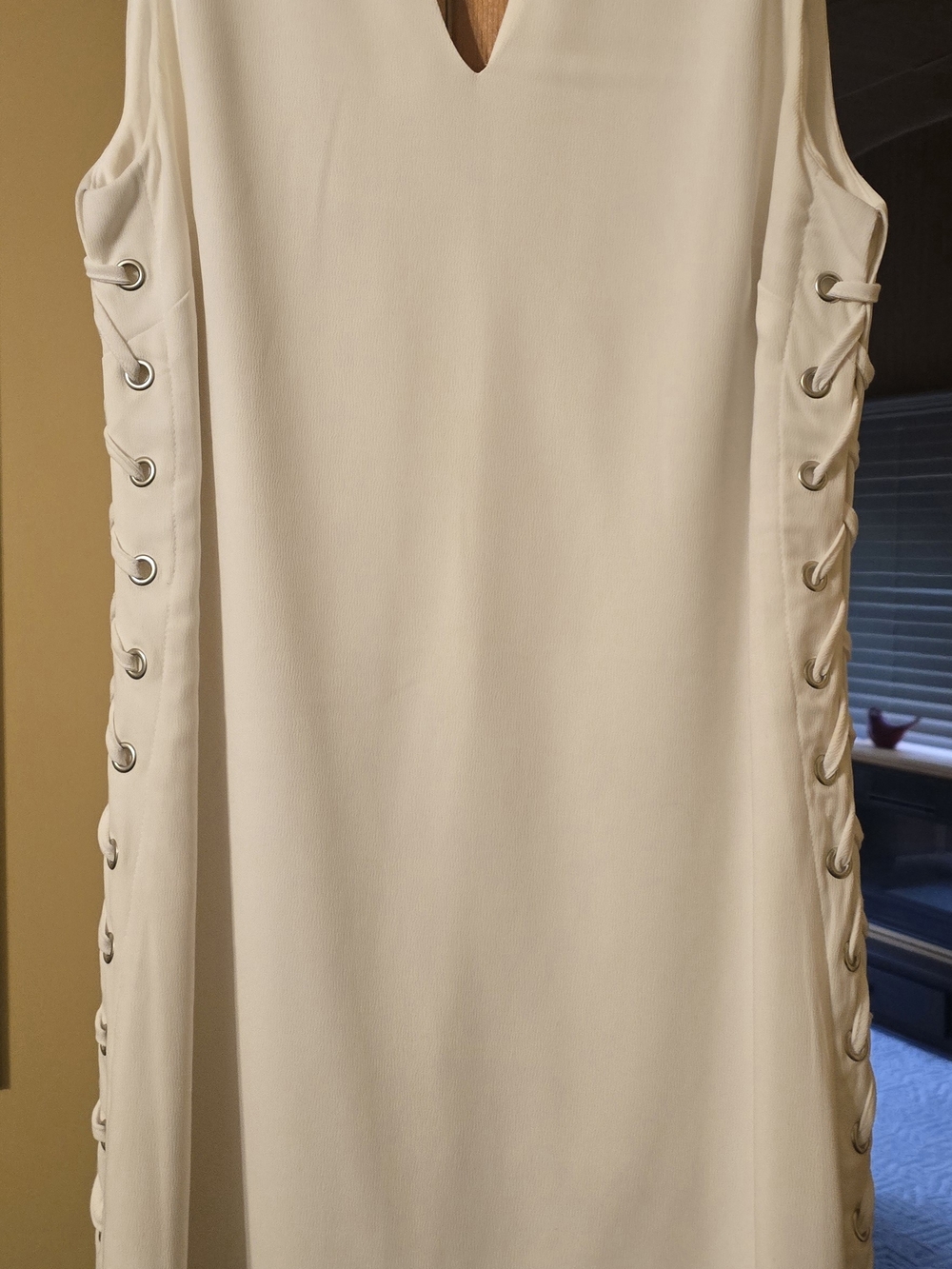 White Sleeveless V-Neck Dress with Side Grommet Detail